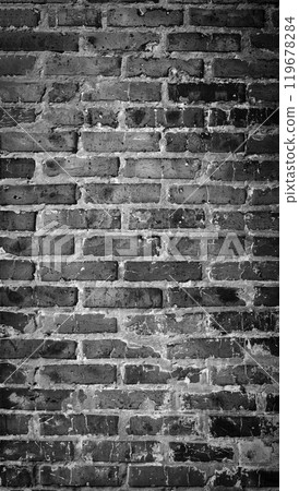 Black and white panorama of old brick wall. Texture of aged masonry with broken brick and peeling plaster. Urban, grunge, industrial, abstract backdrop. Pattern of loft interior or exterior background 119678284