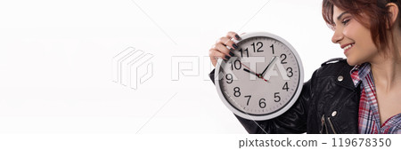 A Young Woman in a Fashionably Stylish Outfit Confidently Holding a Clock with Charisma and Style 119678350
