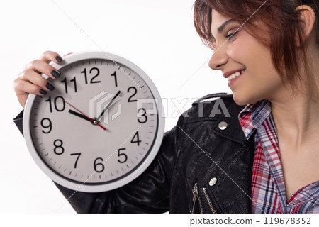 A Woman Delightfully Holding a Beautiful Clock, Radiating a Cheerful Smile on Her Face A Woman Delightfully Holding a Beautiful Clock, Radiating a Cheerful Smile on Her Face 119678352