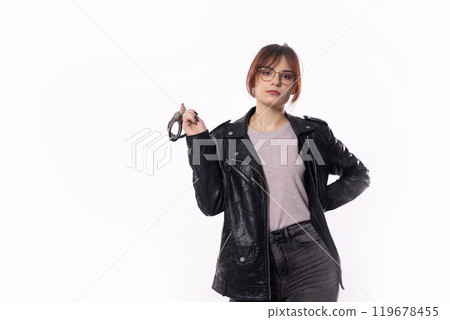 A Stylish Young Woman Dressed in a Trendy Black Outfit with a Unique Sense of Fashion and Glamour 119678455