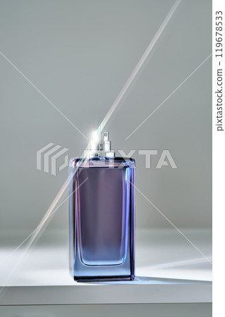 A blue bottle of perfume with a beautiful highlight. A blue bottle of perfume with a beautiful highlight. 119678533