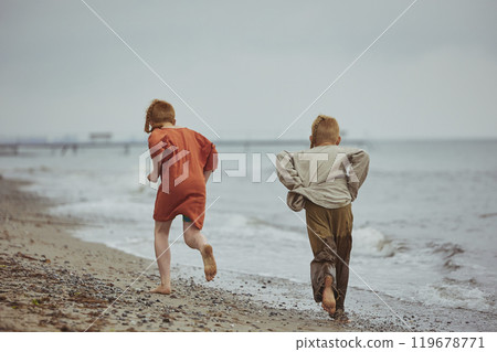 Children in ancient clothes at a Viking festival in Denmark Children in ancient clothes at a Viking festival in Denmark 119678771