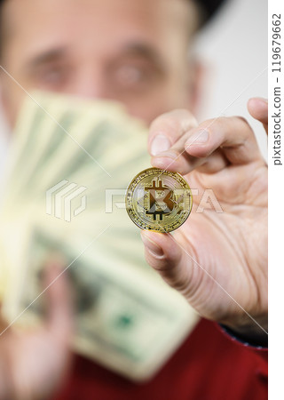 Man having bitcoin coin and cash 119679662
