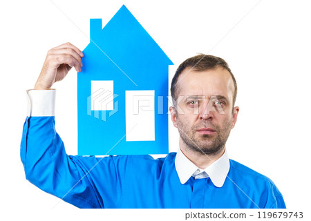 Man holding blue house model 119679743