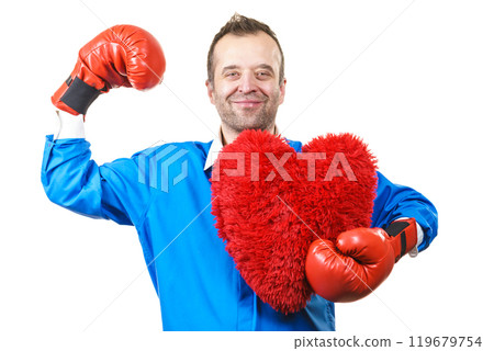 Man with boxing gloves holding heart Man with boxing gloves holding heart 119679754