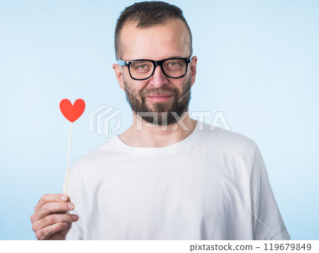 Adult man with heart on stick 119679849