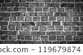 Black and white panorama of old brick wall. Texture of aged masonry with broken brick and peeling plaster. Urban, grunge, industrial, abstract backdrop. Pattern of loft interior or exterior background 119679874