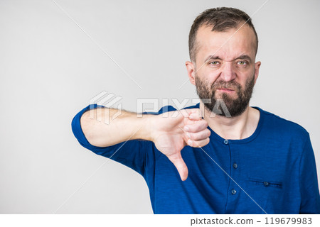 Adult man showing thumbs down gesture 119679983