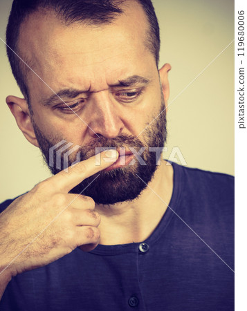 Confused focused serious man thinking Confused focused serious man thinking 119680006