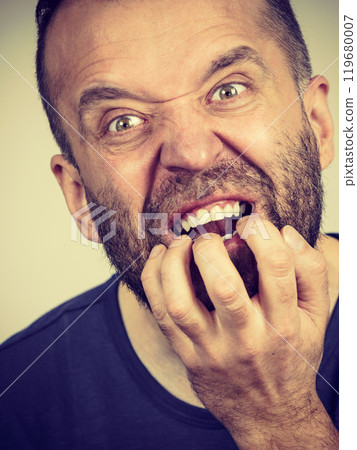 Man biting his nails Man biting his nails 119680007