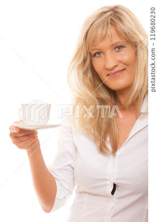 Mature woman drinking tea or coffee.. Mature woman drinking tea or coffee.. 119680230