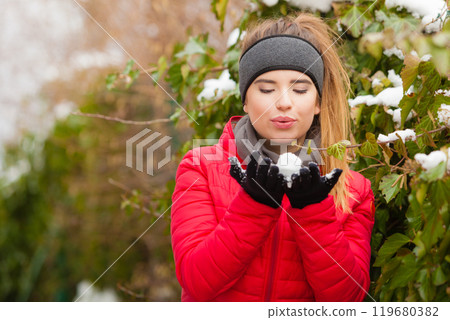 Woman wearing warm clothes spending time in park Woman wearing warm clothes spending time in park 119680382