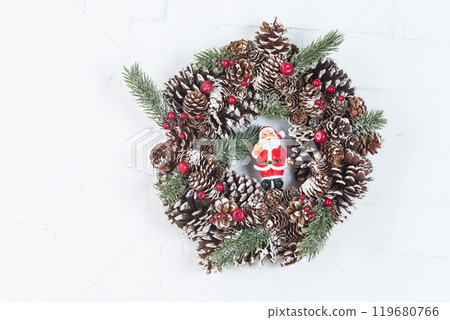 Elegant christmas wreath decorated pine cones and fir trees. Christmas mood. 119680766