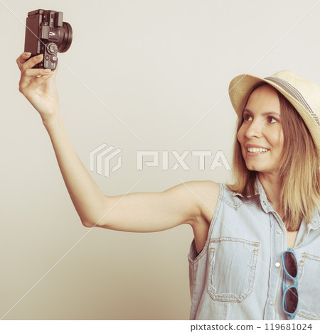 Woman taking selfie self picture with camera. 119681024