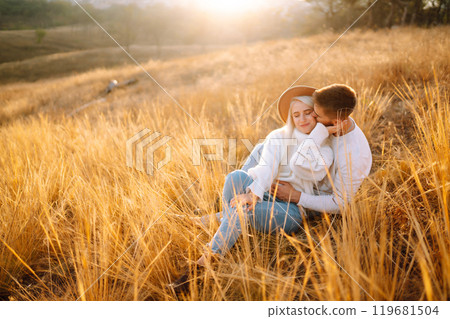 Young couple having fun walking and hugging n the park. Autumn weather. Relaxation, youth. 119681504