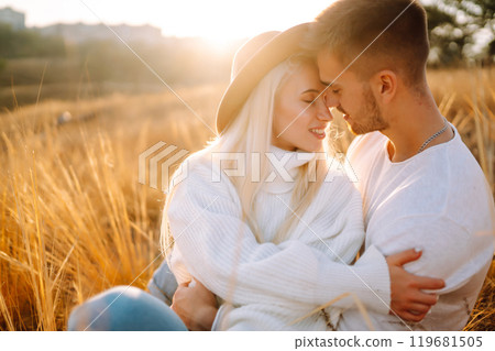 Young couple having fun walking and hugging n the park. Autumn weather. Relaxation, youth. 119681505