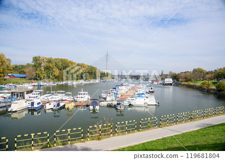 Boat marina at Ada Ciganlija with Ada Bridge, a cable-stayed bridge over the Sava river in Belgrade, Serbia Boat marina at Ada Ciganlija with Ada Bridge, a cable-stayed bridge over the Sava river in Belgrade, Serbia 119681804