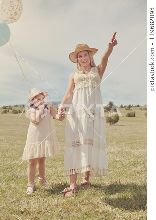 Young mother and her daughter having fun in nature park 119682093