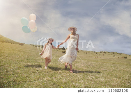 Young mother and her daughter having fun in nature park 119682108