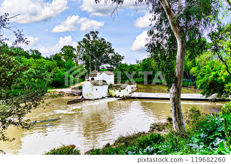 Mill de San Juan next to the banks of the Guadaira, within the Oromana park in Alcala de Guadaira, Seville	 119682260