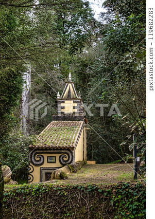 Calvary chapel in the way to the cross, via crucis, trail on ancient forest of Bussaco, in Luso, Aveiro in Portugal. 119682283