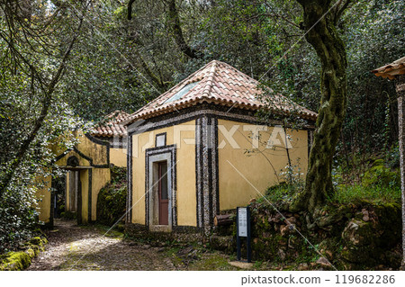 Calvary chapel in the way to the cross, via crucis, trail on ancient forest of Bussaco, in Luso, Aveiro in Portugal. Calvary chapel in the way to the cross, via crucis, trail on ancient forest of Bussaco, in Luso, Aveiro in Portugal. 119682286
