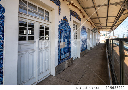 Historic building of old Aveiro Railway station ornamented with typical blue azulejos Historic building of old Aveiro Railway station ornamented with typical blue azulejos 119682311