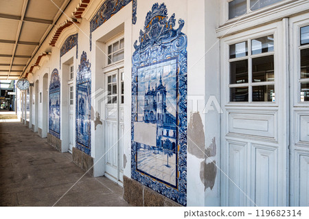 Historic building of old Aveiro Railway station ornamented with typical blue azulejos Historic building of old Aveiro Railway station ornamented with typical blue azulejos 119682314