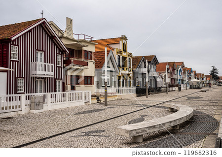 Street with colorful houses. Street with striped houses, Costa Nova, Aveiro, Portugal Street with colorful houses. Street with striped houses, Costa Nova, Aveiro, Portugal 119682316