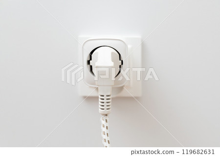 White plug with a white cord attached to it 119682631