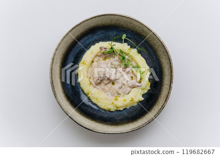 Creamy mashed potatoes with meat stew, a comforting dish perfect for hearty meals and cozy dinners Creamy mashed potatoes with meat stew, a comforting dish perfect for hearty meals and cozy dinners 119682667
