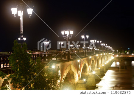 Bordeaux, France. Night view of the Pont Pierre over the Garonne River on August 14, 2024. Bordeaux, France. Night view of the Pont Pierre over the Garonne River on August 14, 2024. 119682875