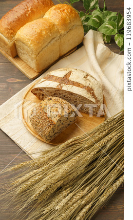 Various breads and ears of wheat 119683954