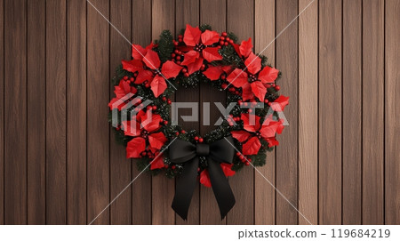A wreath of red poinsettias is hanging on a wooden wall 119684219
