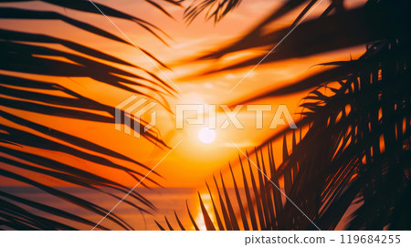 Palm Leaf Silhouette Against Tropical Sunset 119684255