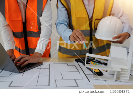Construction and structure concept of Engineer or architect meeting for project working with partner and engineering tools on model building and blueprint in working site, contract for both companies. 119684871