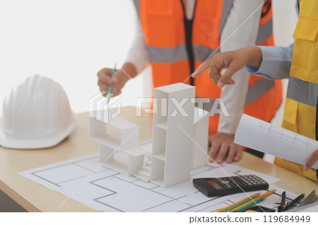 Construction and structure concept of Engineer or architect meeting for project working with partner and engineering tools on model building and blueprint in working site, contract for both companies. Construction and structure concept of Engineer or architect meeting for project working with partner and engineering tools on model building and blueprint in working site, contract for both companies. 119684949