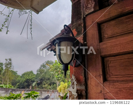 Old Lamp Hanging on The Wall Old Lamp Hanging on The Wall 119686122