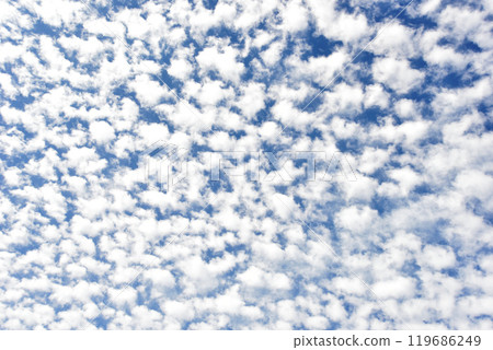 Climatic clouds spread across the autumn sky 119686249