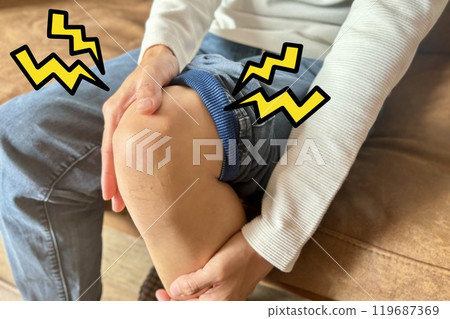 A man's leg with a tingling knee A man's leg with a tingling knee 119687369