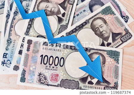 Money and down arrow Money and down arrow 119687374