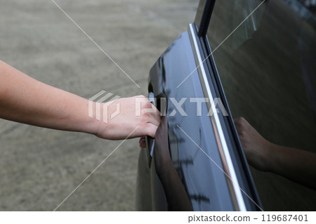 Male hand opening car door Male hand opening car door 119687401