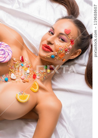 Pretty woman topless with caramel bodyart shot 119688607