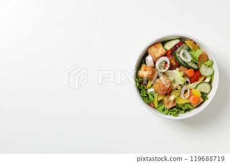 Fried tofu salad in a bowl on a white background Fried tofu salad in a bowl on a white background 119688719