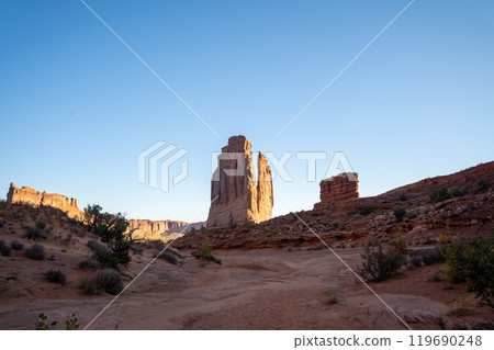 A low-angle view of the Courthouse Towers red rocks in Arches National Park. 119690248