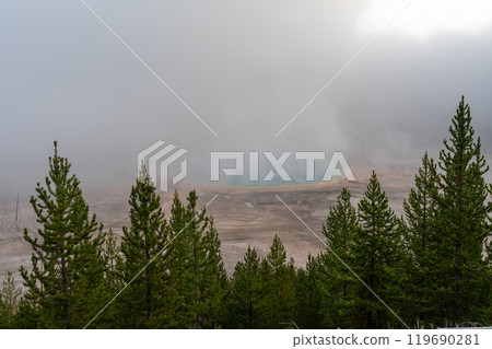 A view of the Grand Prismatic Spring from the overlook on a steamy morning. A view of the Grand Prismatic Spring from the overlook on a steamy morning. 119690281