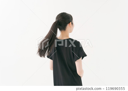 Back view of a woman in a ponytail 119690355