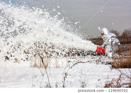 Firemen pouring flame with firefighting foam Firemen pouring flame with firefighting foam 119690592