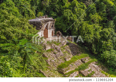 The ancient pyramids of Palenque in Mexico, surrounded by lush jungle. Iconic archaeological site showcasing Mayan culture and history. Travel, history, and adventure concept The ancient pyramids of Palenque in Mexico, surrounded by lush jungle. Iconic archaeological site showcasing Mayan culture and history. Travel, history, and adventure concept 119691204