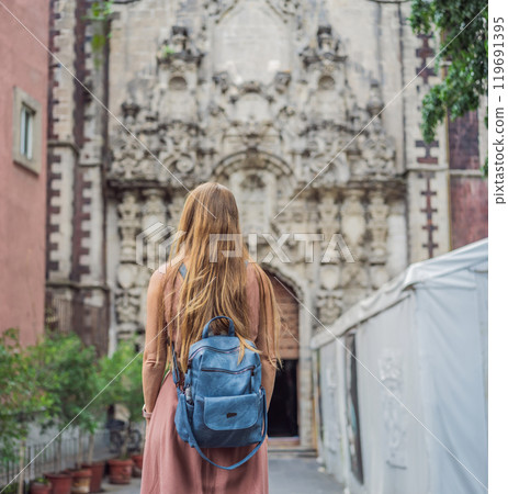 Female tourist in the central square of Mexico City, Zocalo. Cultural exploration, travel, and historic architecture concept 119691395